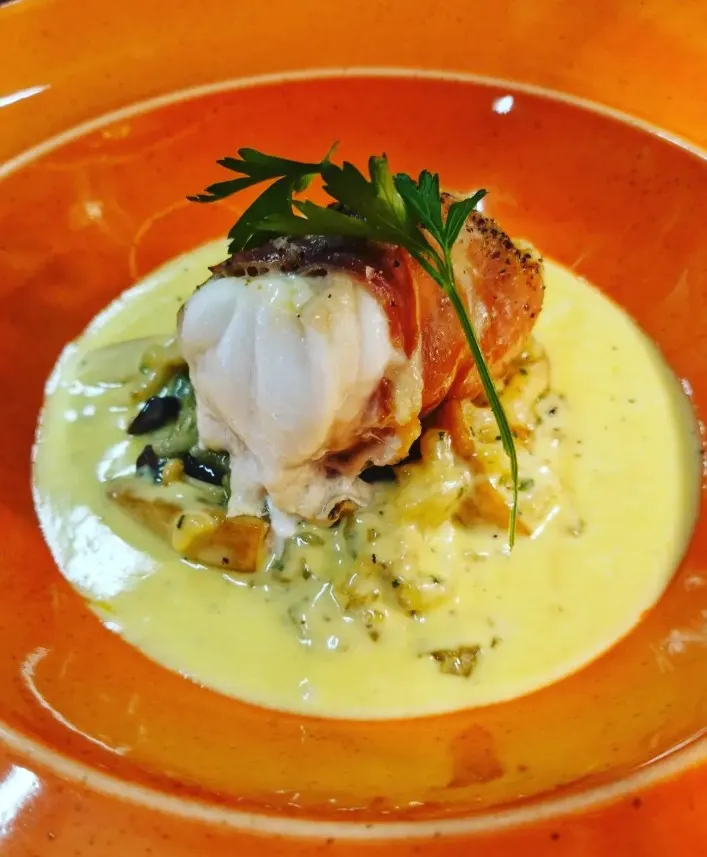 Garnish on orange plate